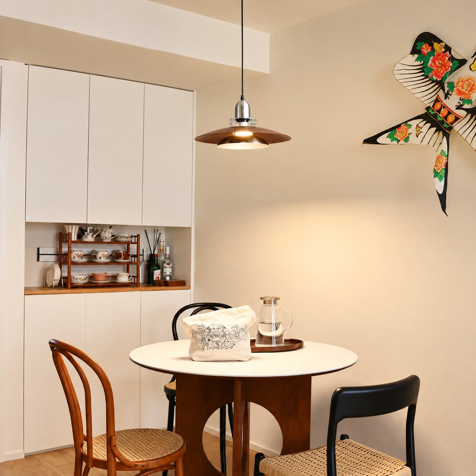 Walnut-tone pendant above a warm, modern dining nook